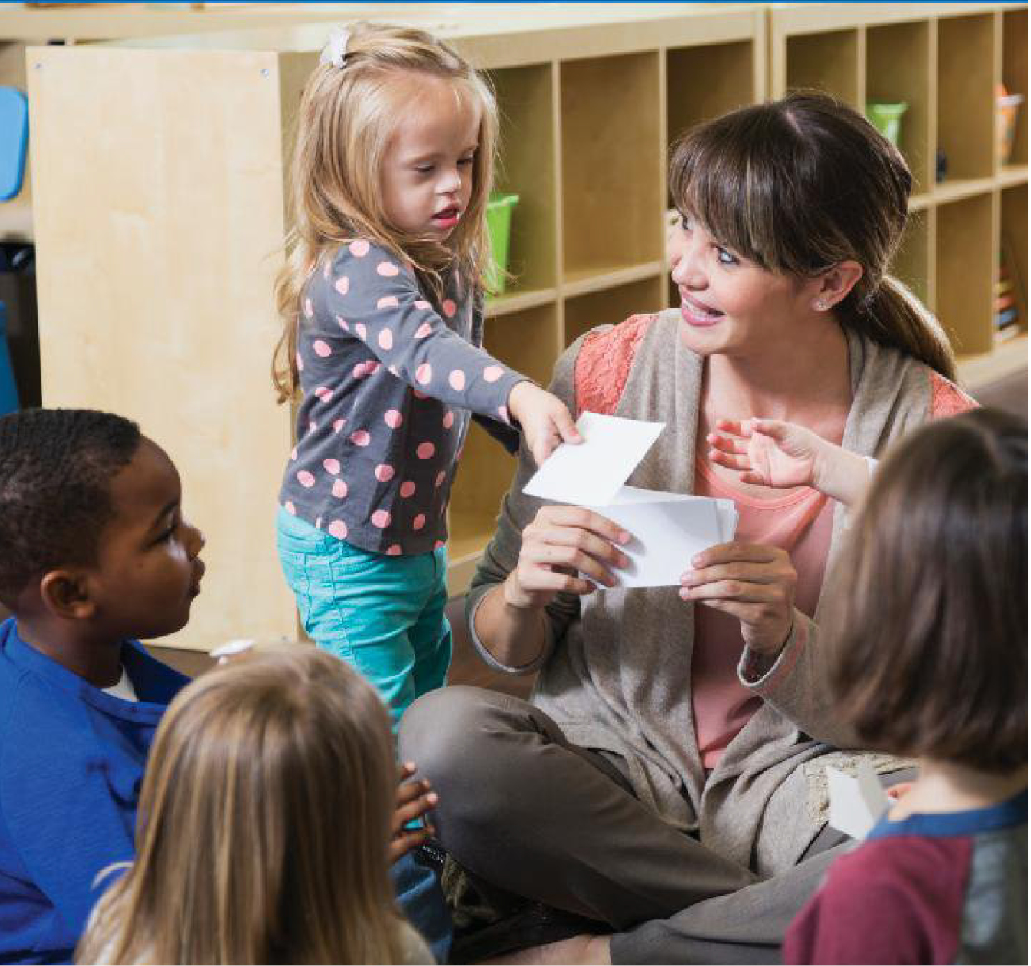 teacher assisting small child student teacher assisting small child student