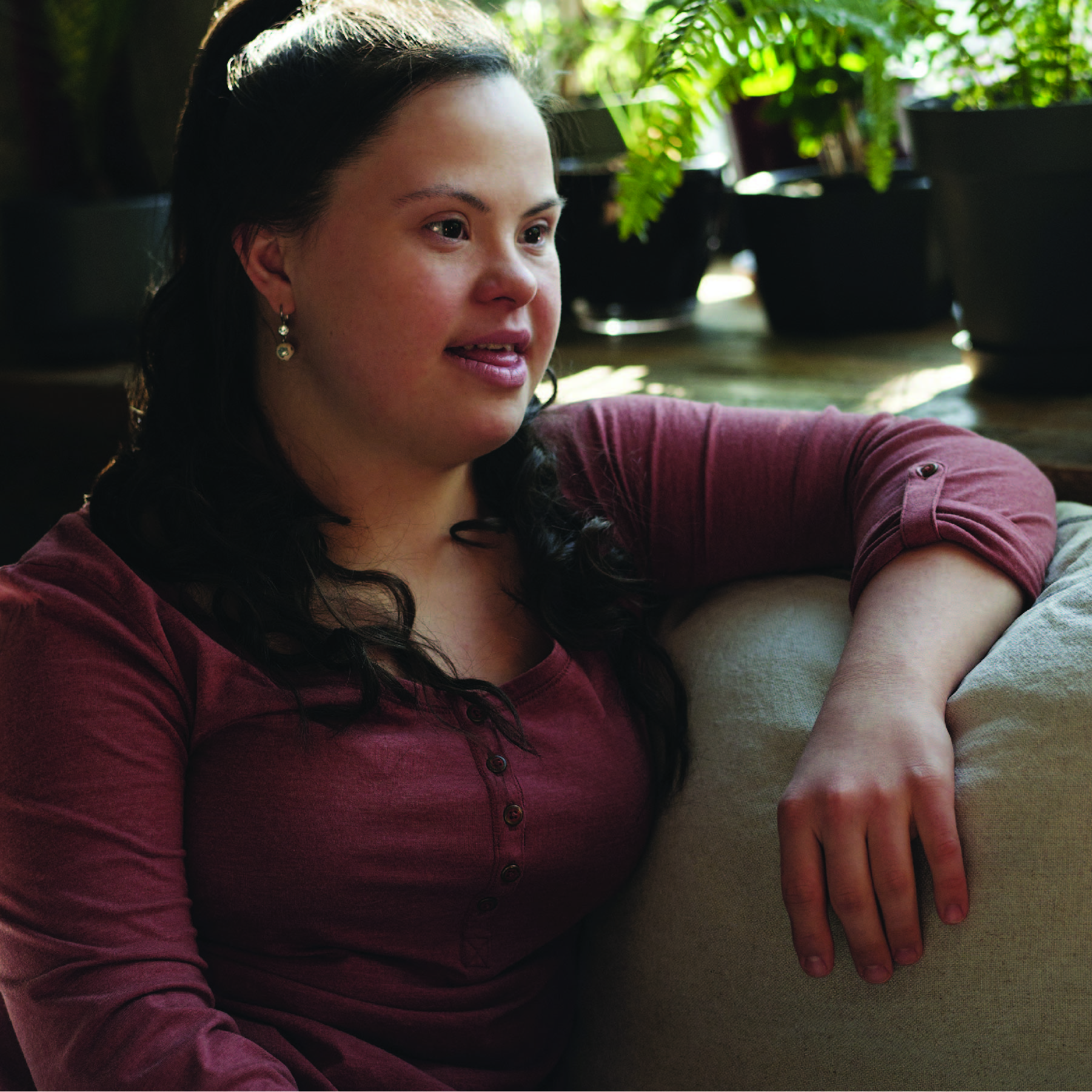 young woman sitting in chair