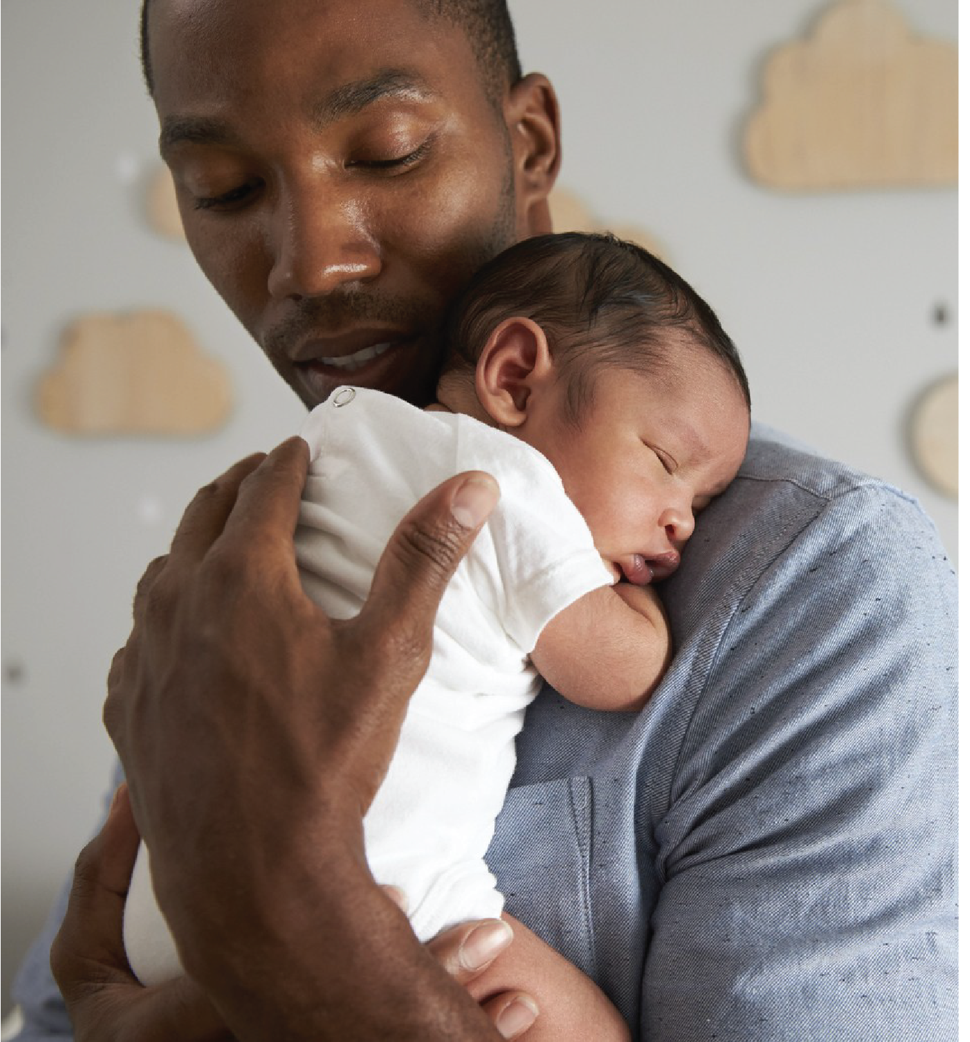 Father holding newborn child Father holding newborn child