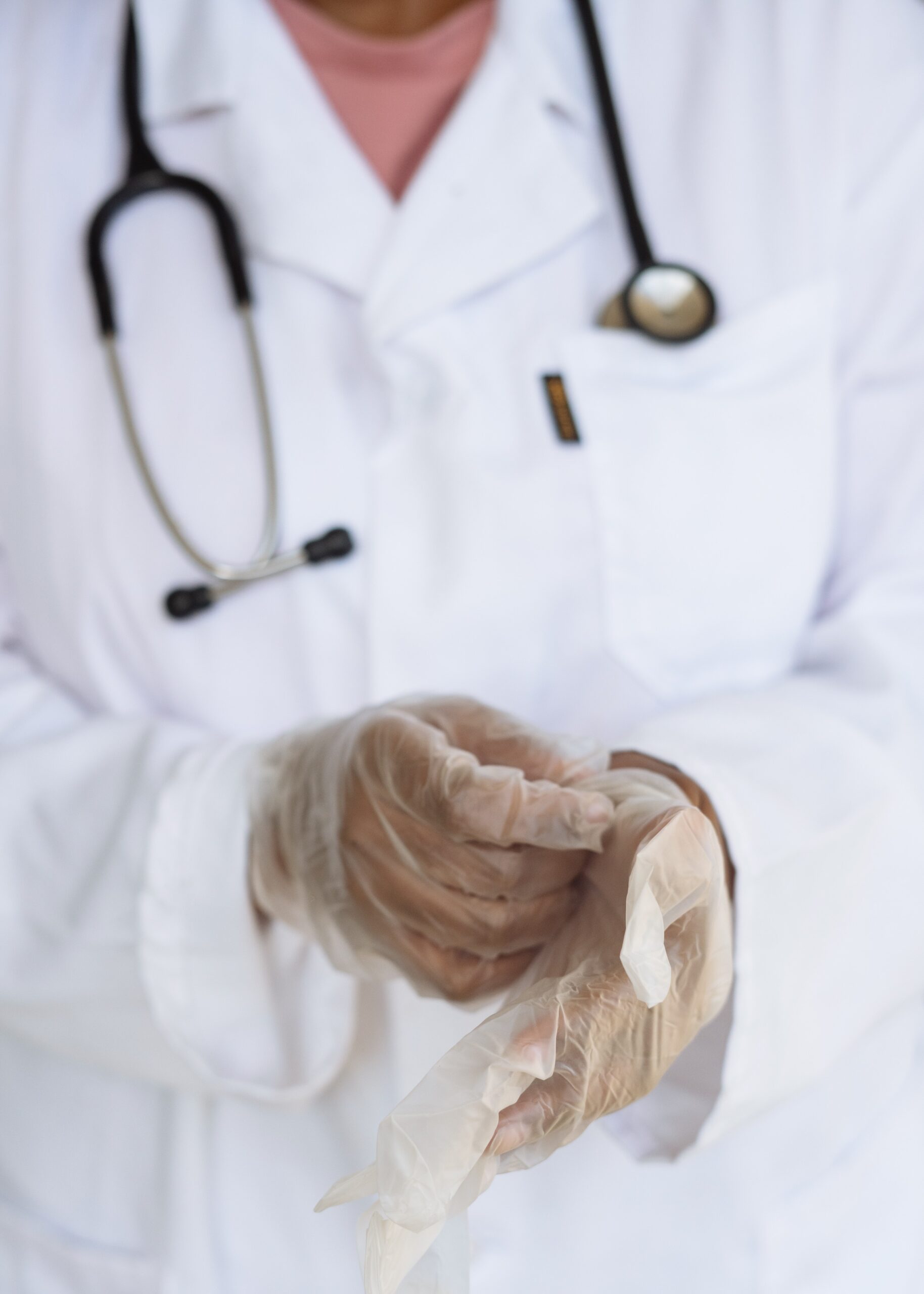 doctor putting on gloves doctor putting on gloves